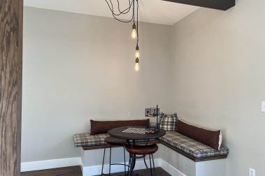 Corner Bench located at the Clubhouse at The Timbers, a Socha Companies community